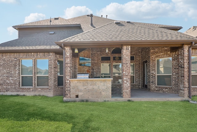 back of property featuring a patio area and a yard