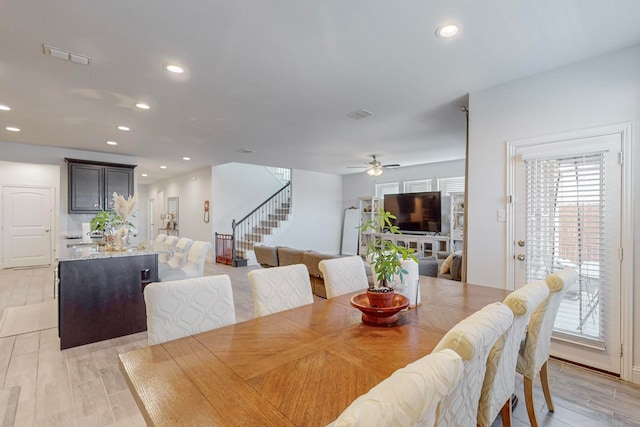 dining space featuring ceiling fan and light hardwood / wood-style floors