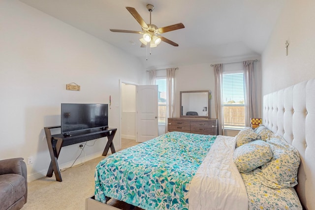 bedroom with ceiling fan, carpet floors, and vaulted ceiling