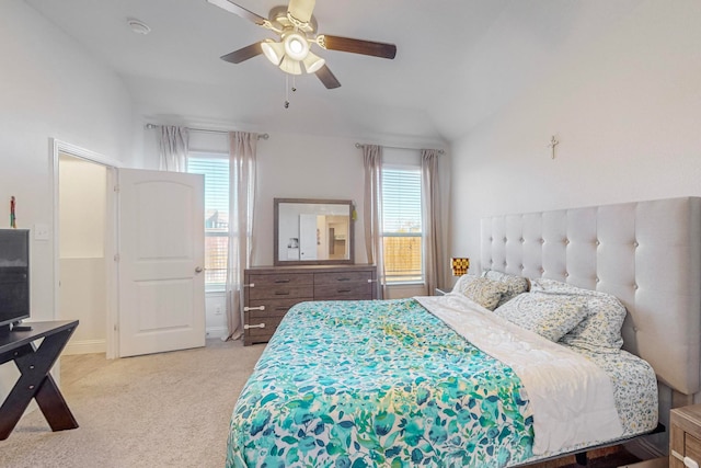 bedroom with light carpet, vaulted ceiling, and ceiling fan