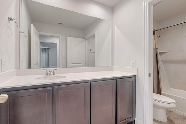 full bathroom with tile patterned floors, vanity, shower / bath combo, and toilet