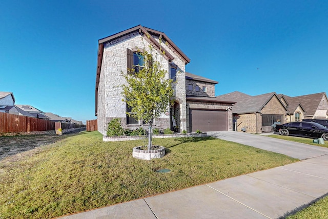 view of front of property featuring a garage and a front yard