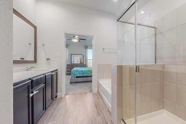 bathroom with vanity, separate shower and tub, and ceiling fan