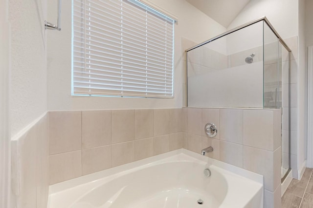 bathroom with plus walk in shower and lofted ceiling