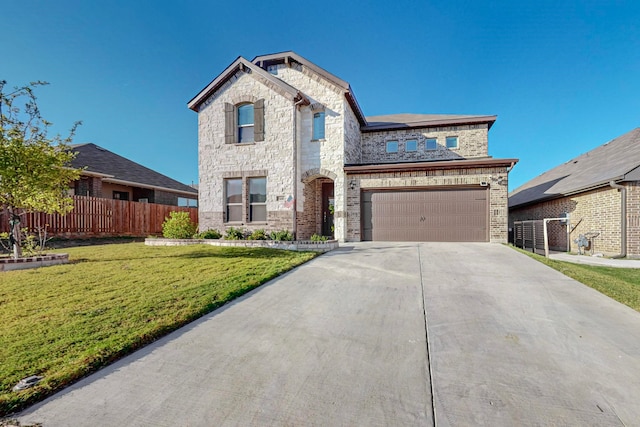 view of front of property featuring a front lawn and a garage