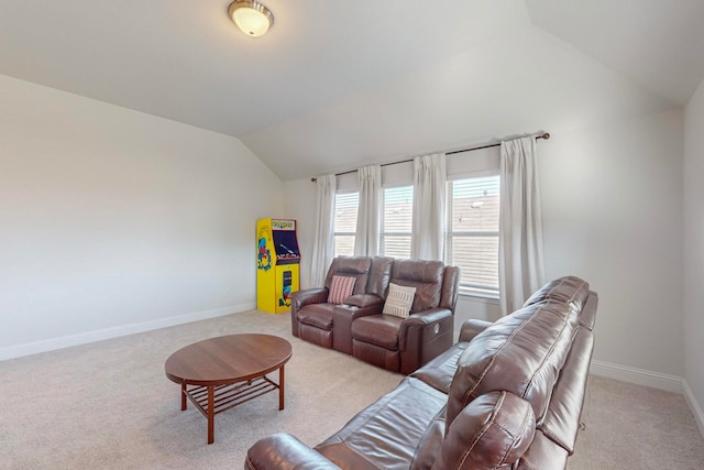 living room with light colored carpet and vaulted ceiling