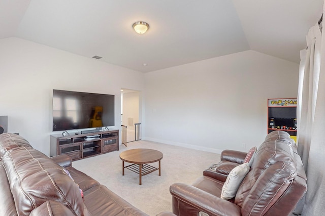 carpeted living room with lofted ceiling