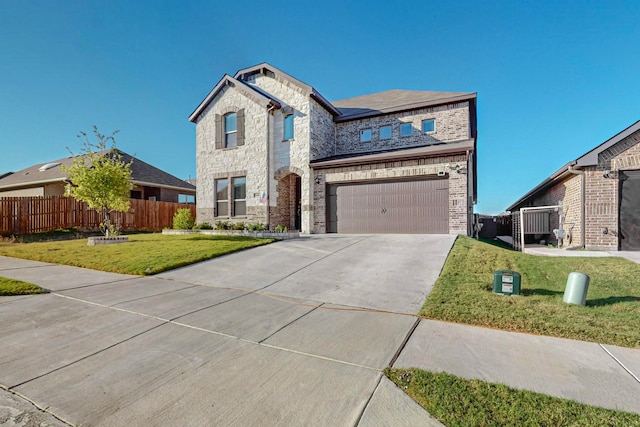 view of front facade with a front lawn and a garage