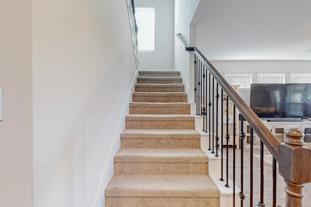 stairs with wood-type flooring