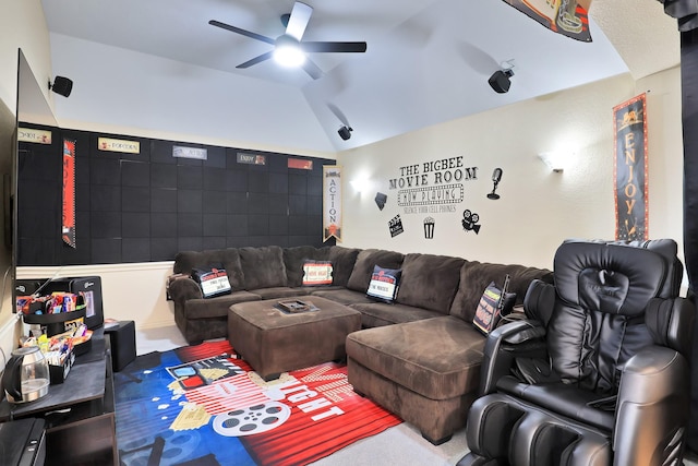 living room featuring carpet flooring, ceiling fan, and lofted ceiling