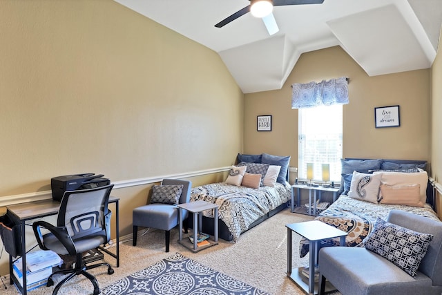 bedroom with ceiling fan, light colored carpet, and vaulted ceiling