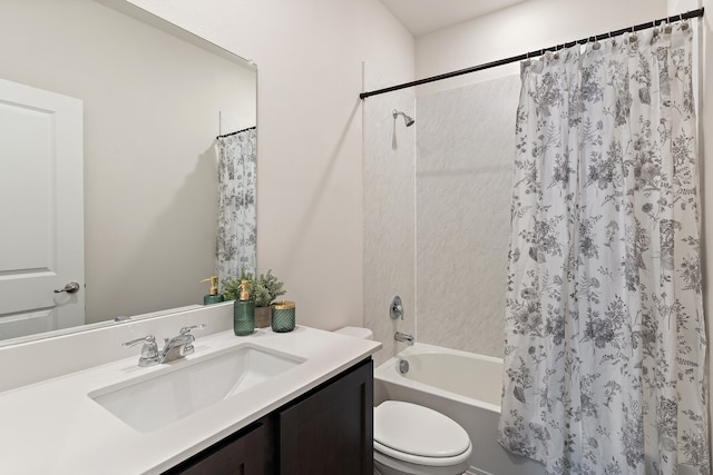 full bathroom with vanity, shower / tub combo with curtain, and toilet