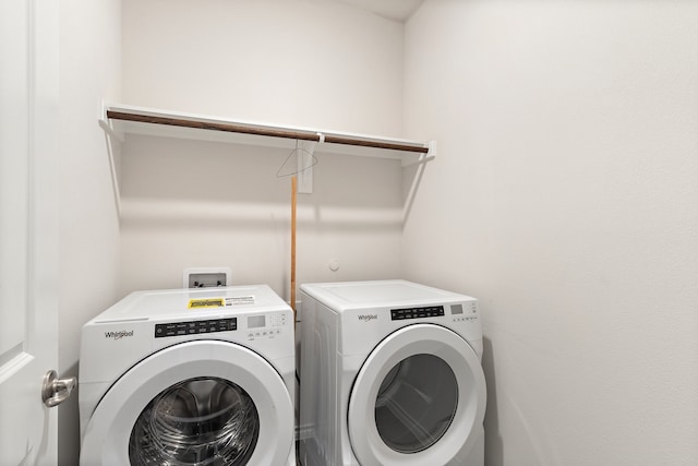 clothes washing area featuring washing machine and dryer