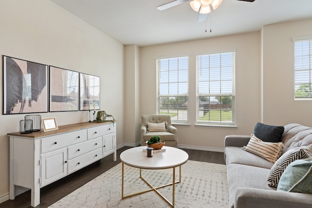 sitting room featuring dark wood-type flooring and ceiling fan