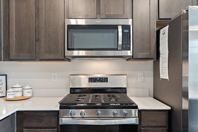 kitchen with dark brown cabinetry and stainless steel appliances