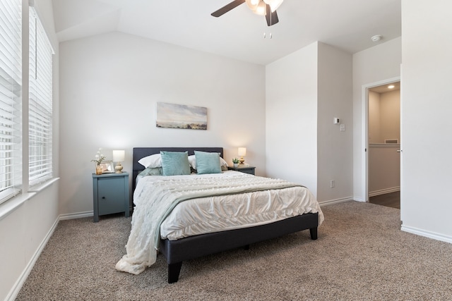 carpeted bedroom with ceiling fan and lofted ceiling