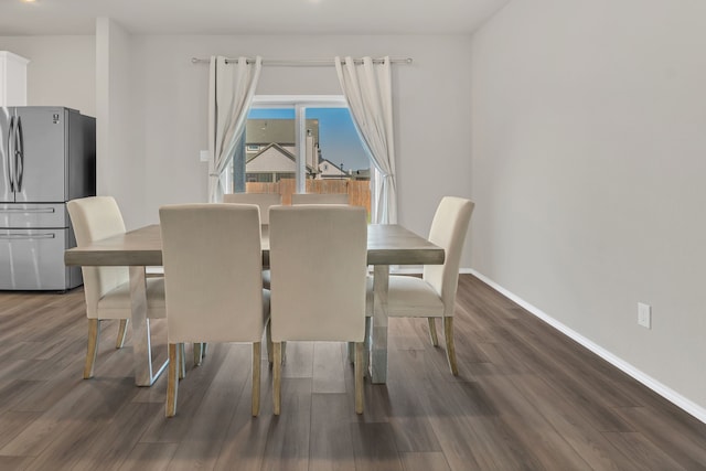 dining area with dark wood-type flooring