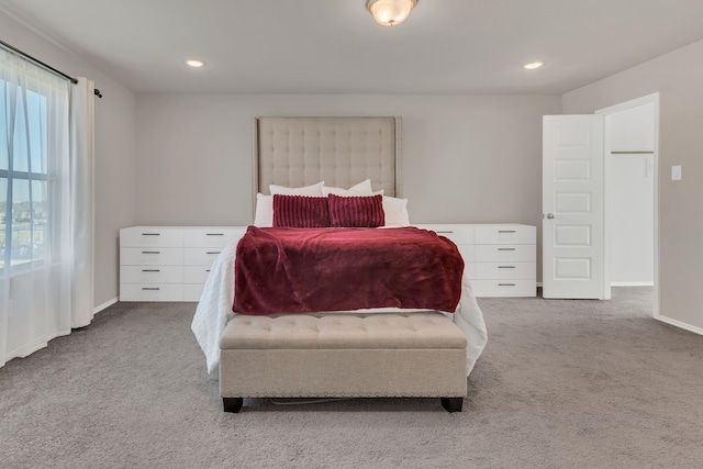 carpeted bedroom with multiple windows