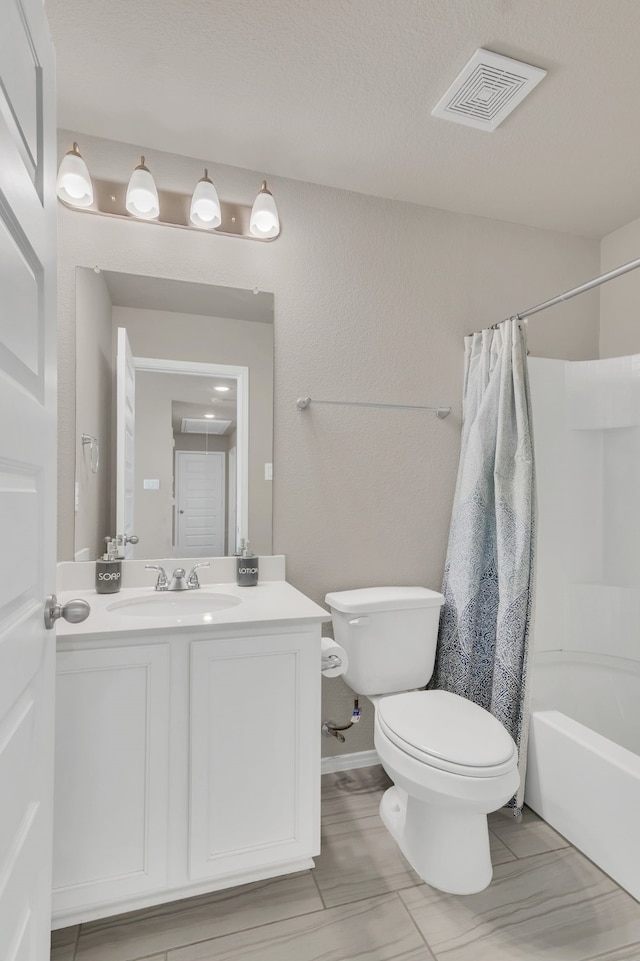 full bathroom with vanity, toilet, and shower / bath combo