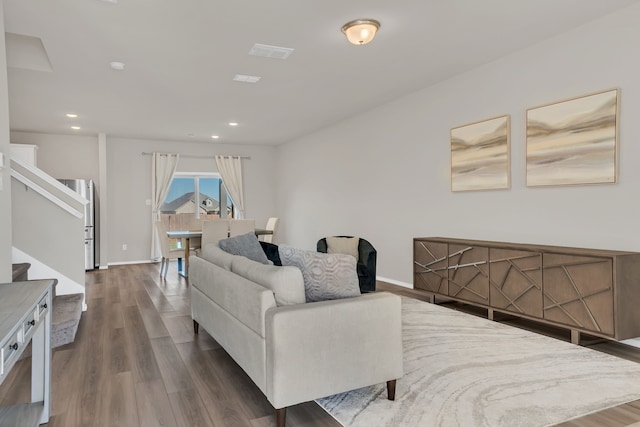 living room featuring dark hardwood / wood-style floors