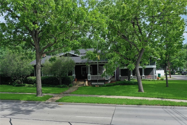 view of front of house with a front lawn and a porch