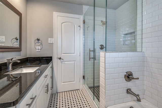 bathroom with vanity and an enclosed shower