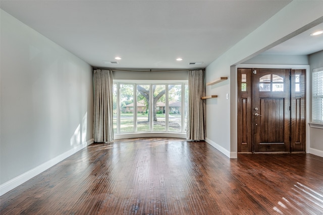 entryway with dark hardwood / wood-style floors and plenty of natural light