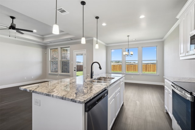 kitchen featuring sink, a center island with sink, white cabinets, and appliances with stainless steel finishes