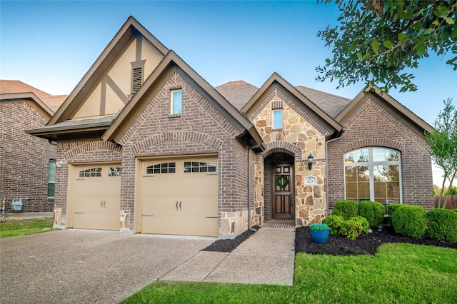 english style home with a garage