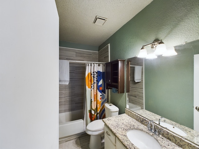 full bathroom with toilet, a textured ceiling, shower / tub combo with curtain, and vanity