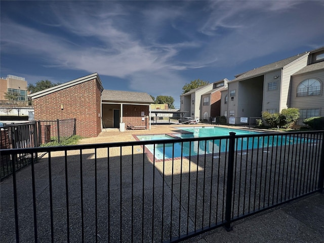 view of swimming pool featuring a patio area