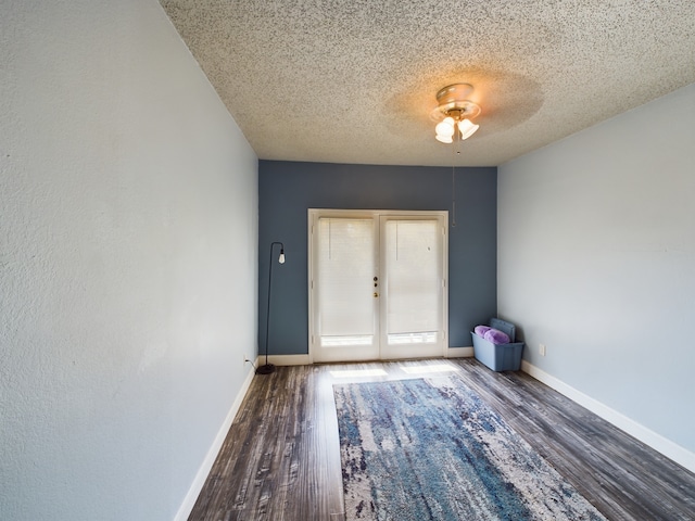 9747 Whitehurst Dr Unit 146, Dallas, TX 75243 - doorway featuring wood finished floors, a textured ceiling, baseboards, and a ceiling fan