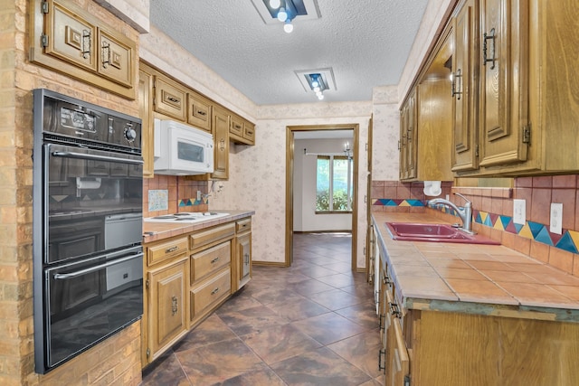 kitchen with decorative backsplash, tile countertops, a textured ceiling, sink, and white appliances