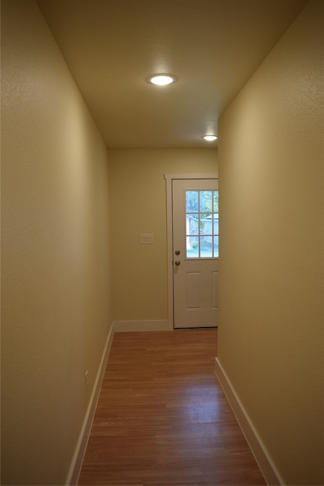 doorway to outside with hardwood / wood-style flooring