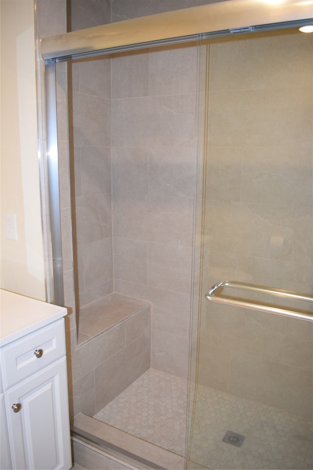 bathroom with vanity and an enclosed shower