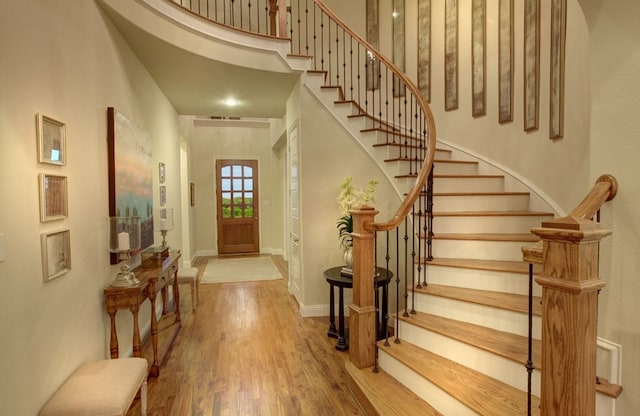 3124 Shaddock Blvd, Rockwall, TX 75032 - foyer featuring a high ceiling, stairway, visible vents, baseboards, and wood finished floors