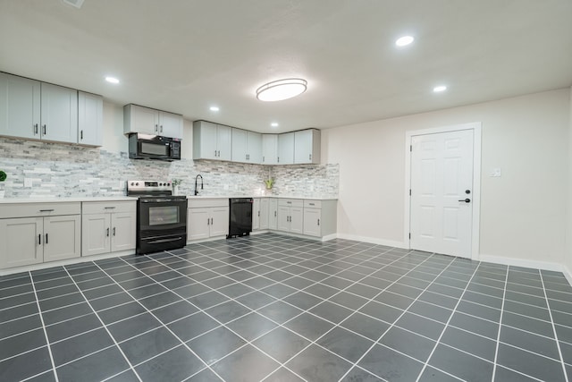 kitchen featuring white cabinetry, black appliances, and sink