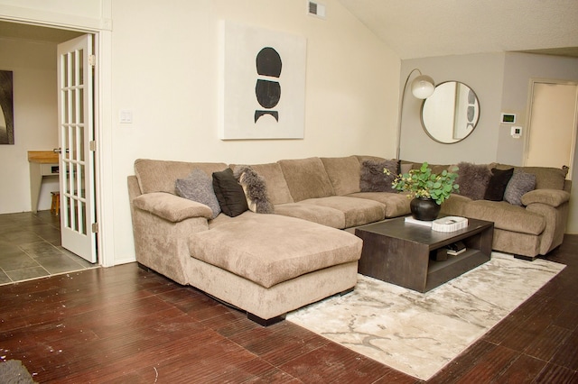 living room with lofted ceiling and dark hardwood / wood-style floors