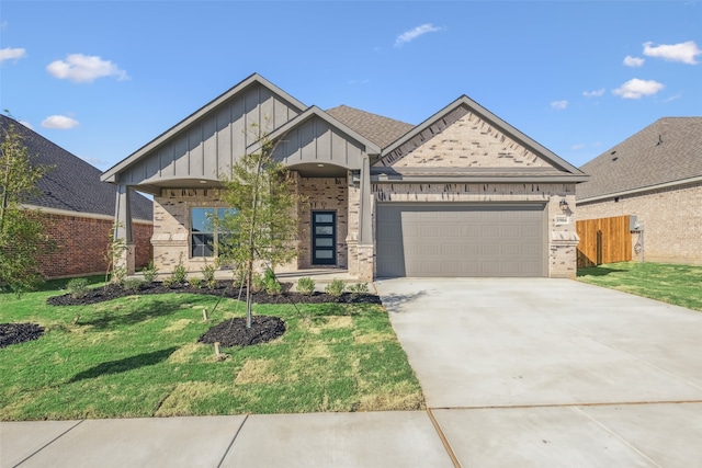 view of front of home with a garage and a front yard