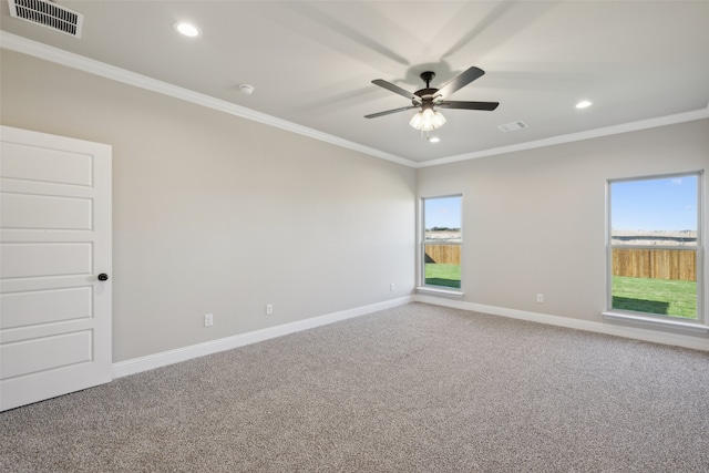 unfurnished room with crown molding, carpet floors, and ceiling fan