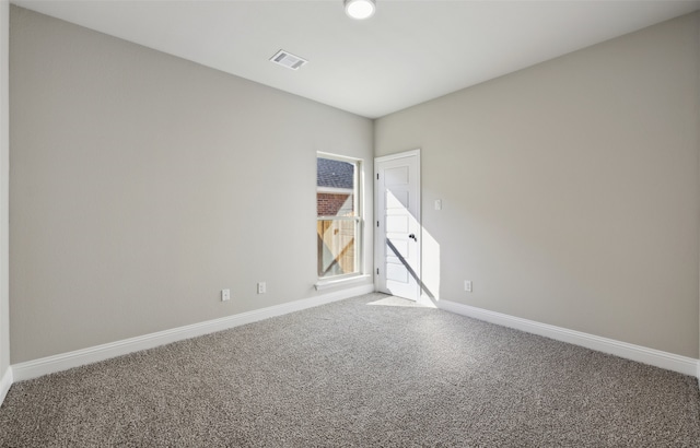 unfurnished room featuring carpet floors