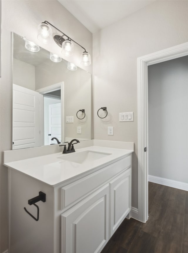 bathroom with vanity and hardwood / wood-style flooring