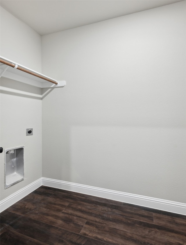 clothes washing area featuring electric dryer hookup and dark hardwood / wood-style floors