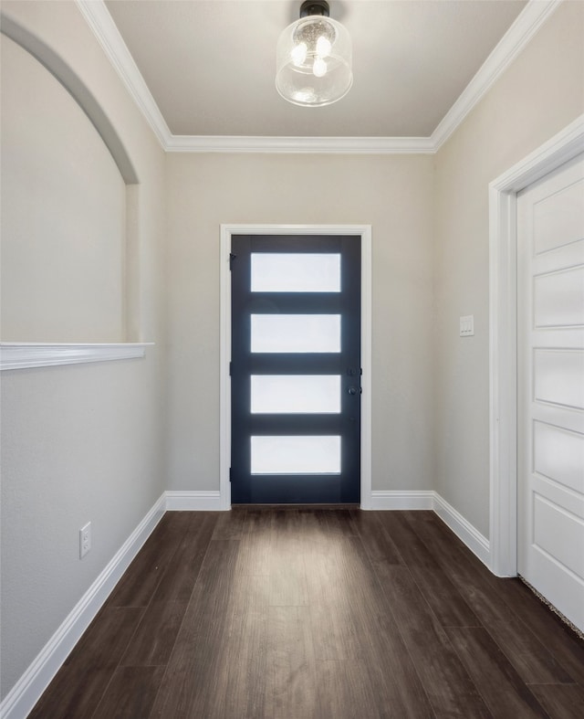 foyer entrance featuring ornamental molding and dark wood-type flooring