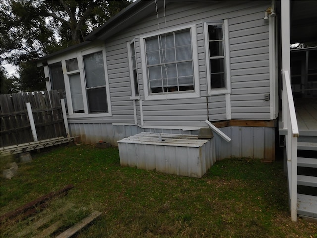 view of side of property featuring a lawn