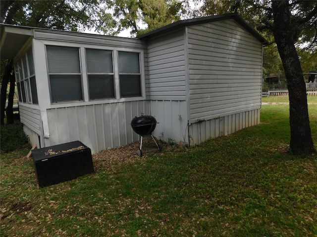 view of home's exterior with a yard