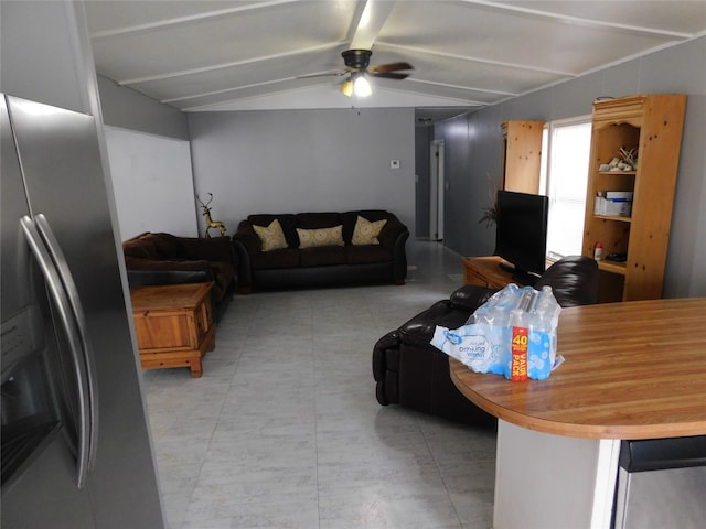 living room with ceiling fan and vaulted ceiling