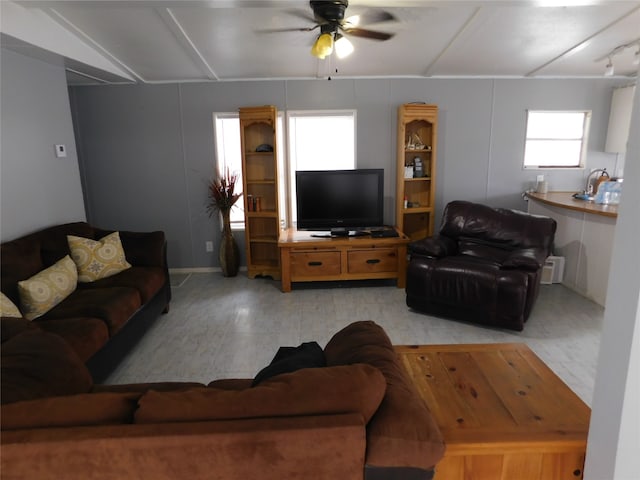 living room with ceiling fan and light hardwood / wood-style floors