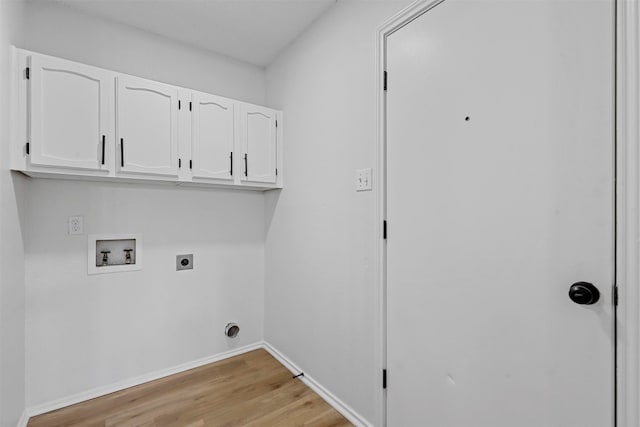 laundry area featuring hookup for a washing machine, light hardwood / wood-style flooring, cabinets, and hookup for an electric dryer