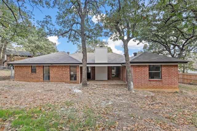 back of house with a patio